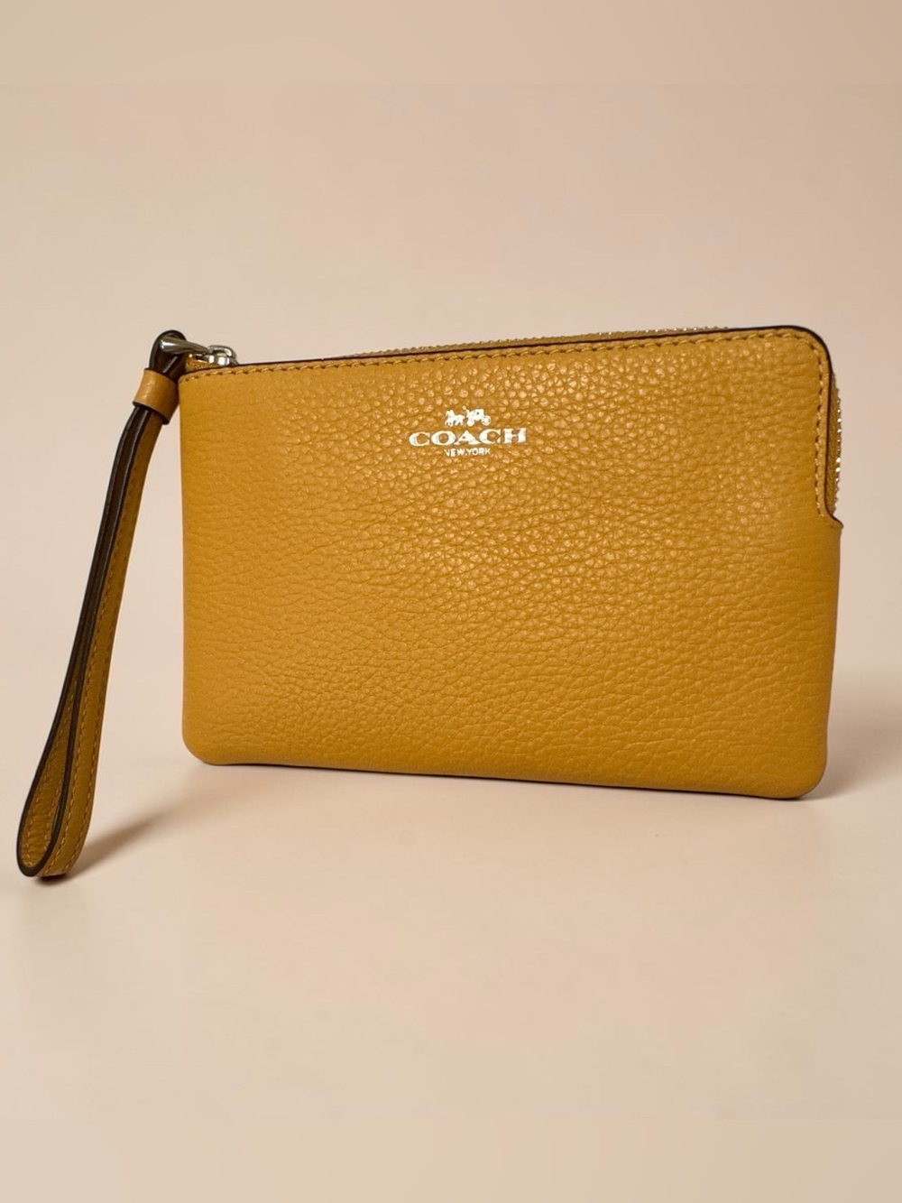 Coach Pebbled Leather Corner Zip Wristlet.